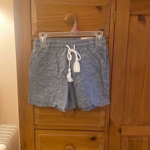 NWT ruffled dolphin hem beach shorts